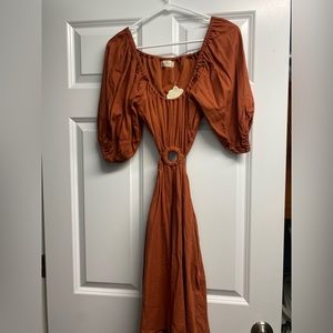 Altard state! orange dress with side cut outs and an open back. Ring opening.